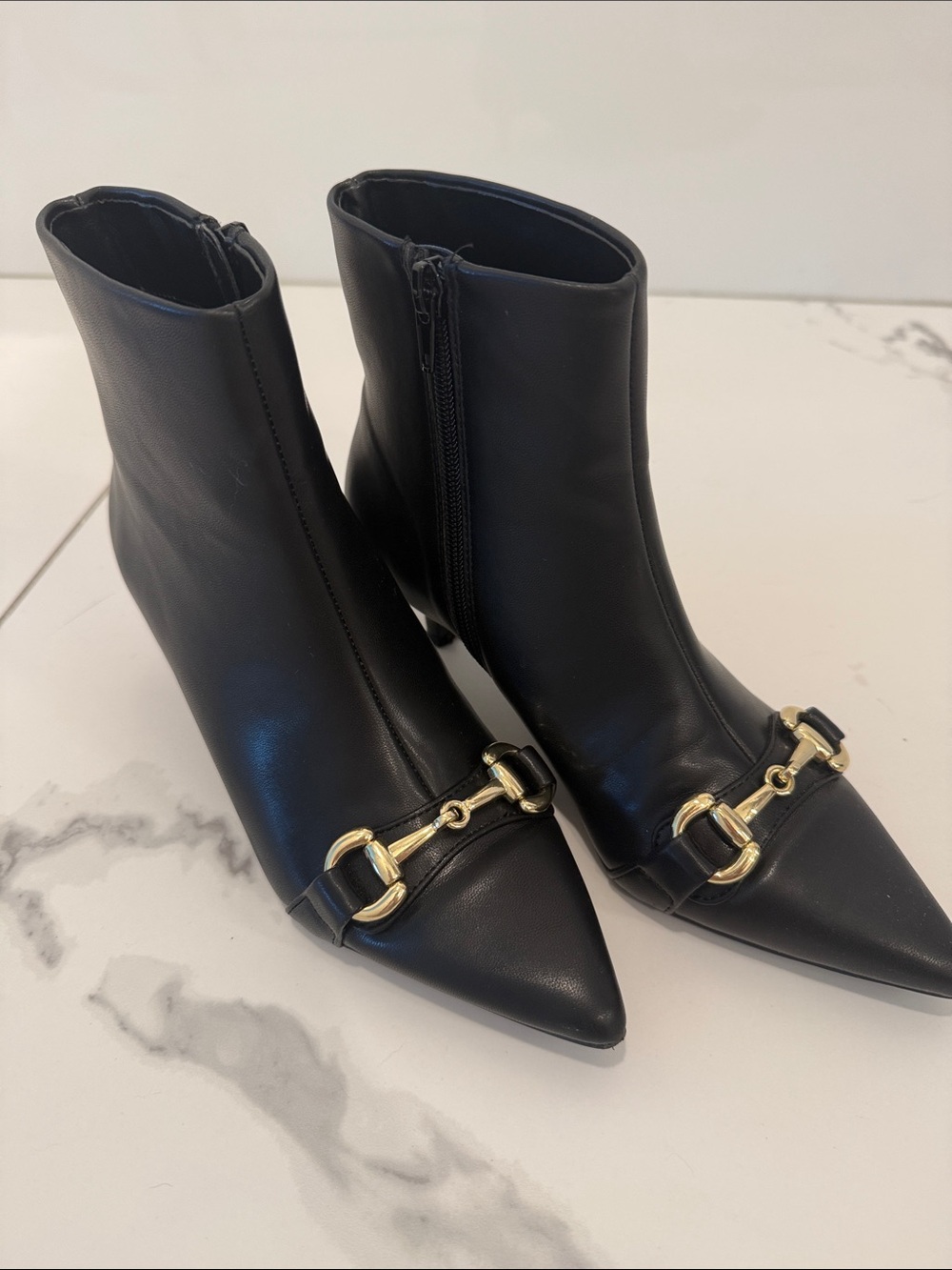 BCBGeneration Black Pointed Toe Ankle Booties with Gold Horsebit